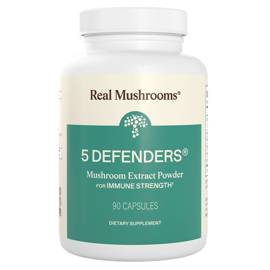 A white bottle labeled "5 Defenders® Organic Mushroom Blend Capsules" by Real Mushrooms, featuring a powerful mushroom complex with 90 capsules for immune support.