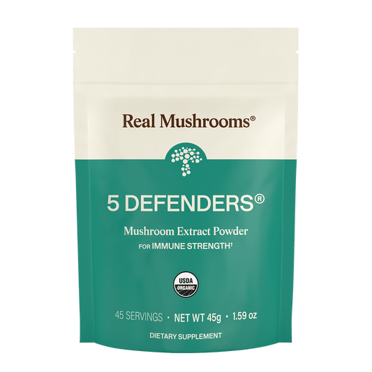 A teal and white "Real Mushrooms" package displays 5 Defenders® Organic Mushroom Complex – Bulk Powder, a 45g dietary supplement rich in beta-glucans for immune support.