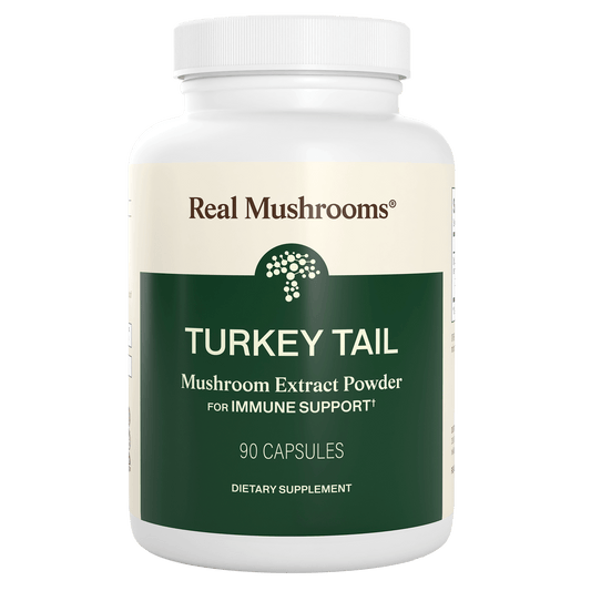 A white bottle labeled "Real Mushrooms Turkey Tail Mushroom Capsules," containing 90 capsules rich in beta-glucans for immune support.